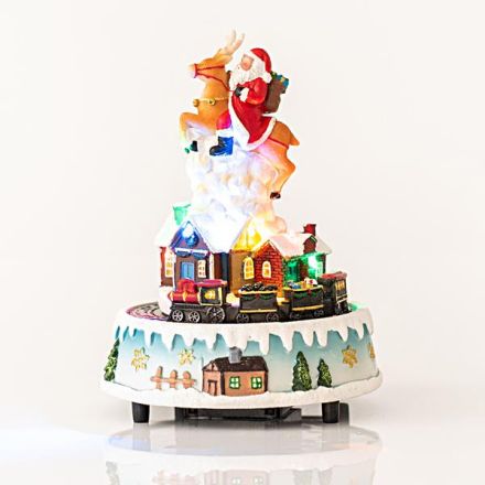 SANTA ON REINDEER, WITH TRAIN, 7 LED, WITH ADAPTOR, WITH MUSIC AND MOVEMENT, 18x18x25cm